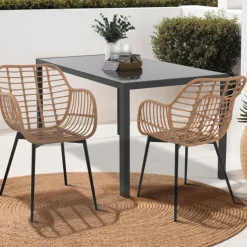 2 fauteuils de table effet rotin et pied métal noir