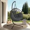Fauteuil rond suspendu ajouré effet rotin gris avec coussin gris