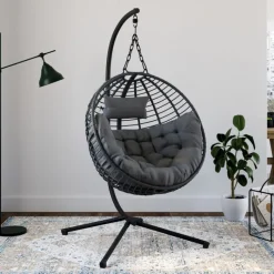 Fauteuil rond suspendu ajouré effet rotin gris avec coussin gris