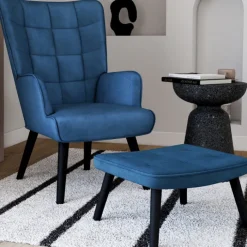 Fauteuil scandinave en velours bleu avec repose-pieds
